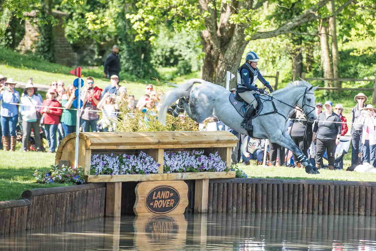 cross country horse and rider at water jump